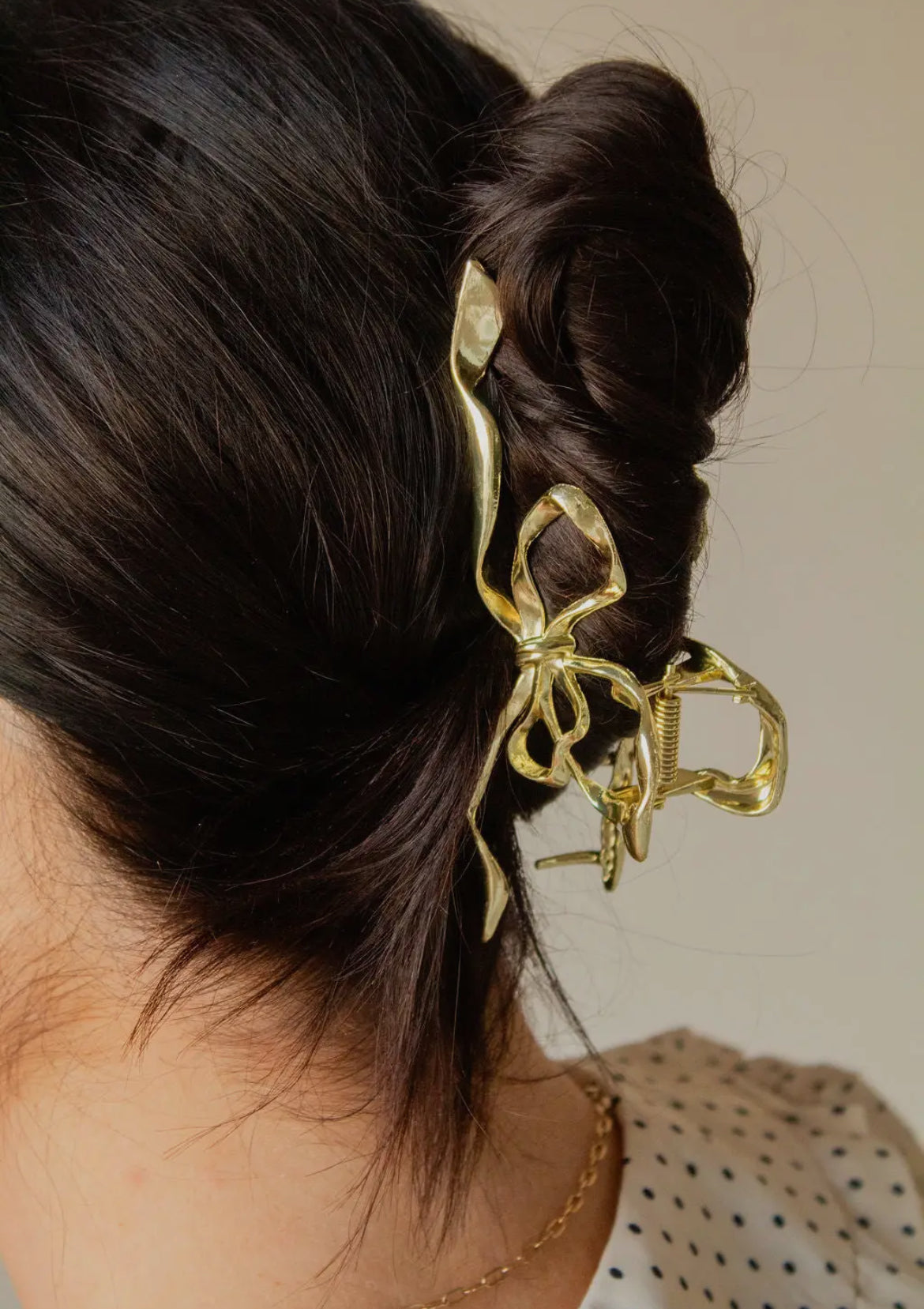 Shop ANDi Gold Bow Squiggle Claw Clip
